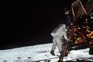 Astronaut Edwin Aldrin descends steps of Lunar Module ladder to walk on moon