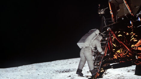 Astronaut Edwin Aldrin descends steps of Lunar Module ladder to walk on moon